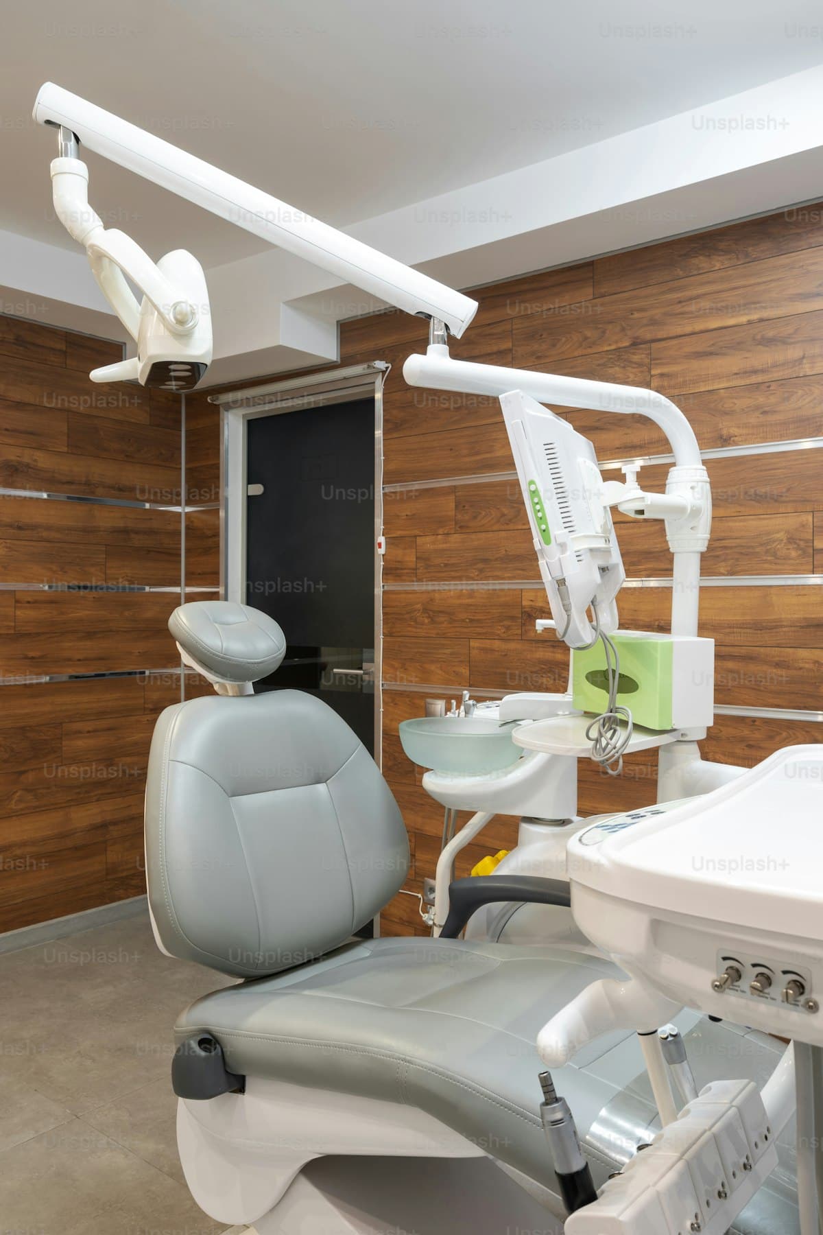 Modern dental office interior with examination equipment and patient chair