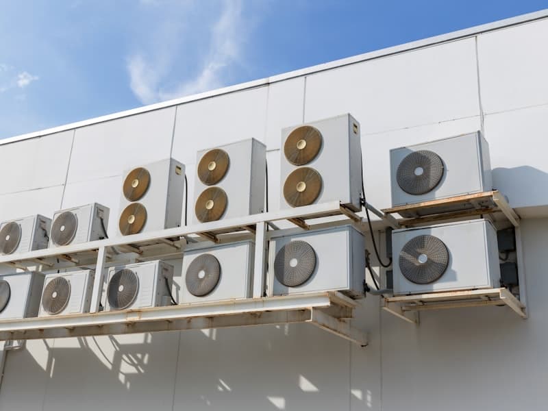 Commercial HVAC air conditioning units mounted on building exterior